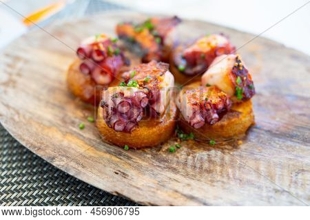 Spanish Starter In Fish Restaurant In Getaria, Grilled Octopus With Roasted Potatoes And Paprika, Ba
