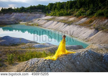 Ukrainian Patriot Girl In A Yellow Dress Against A Blue Sky. Summer Photo. Blue Sky. Sunny Day. Free