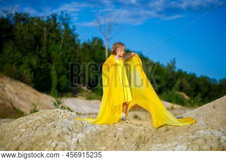 Ukrainian Patriot Girl In A Yellow Dress Against A Blue Sky. Summer Photo. Blue Sky. Sunny Day. Free