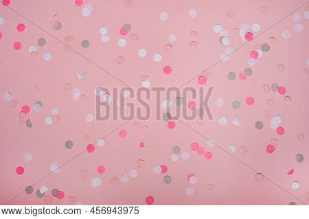 Party Colorful Confetti Over Pink Background . Top View, Flat Lay