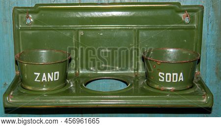 Enkhuizen, Netherlands. June 2022. Old-fashioned Enamel Pots For Sand, Soap And Soda At The Zuiderze