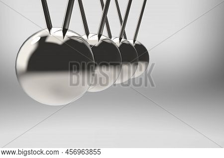 3d Rendering. Swinging Pendulum Group On Gray Background.