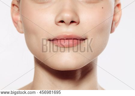 Closeup Female Lips, Cheeks And Nose Isolated Over White Studio Background. Concept Of Cosmetology, 