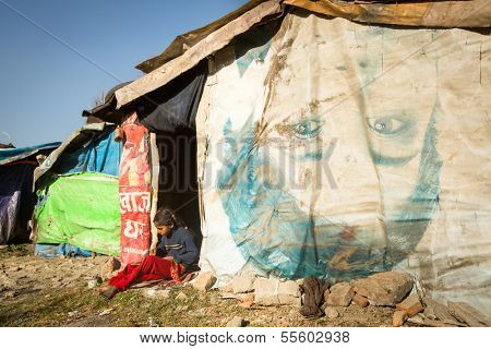 KATHMANDU, NEPAL - DEC 16: Unidentified poor child near their houses at slums in Tripureshwor district, Dec 16, 2013 in Kathmandu, Nepal. Caste of untouchables in Nepal, is about 7 % of population.