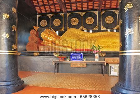 NORTHERN THAILAND - APRIL 14, 2011: Statue of the Lying Buddha. The Buddha in gold lacy clothes