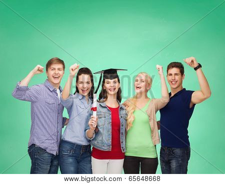 education and people concept - group of standing smiling students with diploma and corner-cap