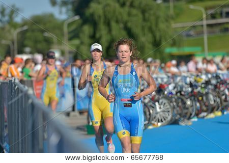 DNEPROPETROVSK, UKRAINE - MAY 24, 2014: Oleksandra Gryshyna and Dariya Fedchenko of Ukraine run on the third stage of ETU Sprint Triathlon European cup