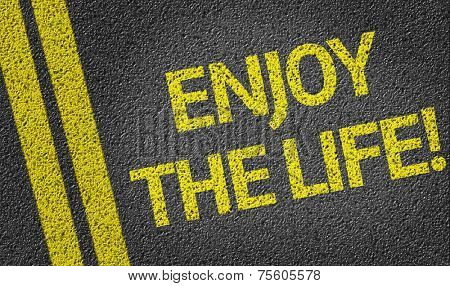 Enjoy the Life written on the road