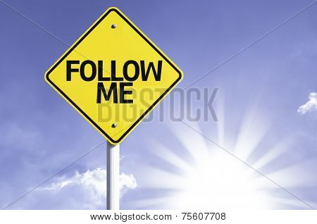 Follow Me road sign with sun background 