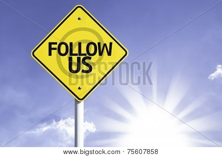 Follow Us road sign with sun background 