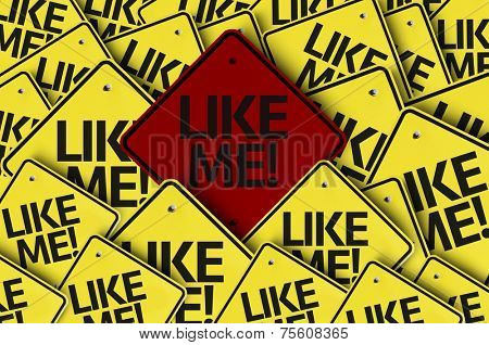 Like Me! written on multiple road sign