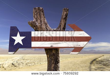 Liberia wooden sign with a desert background