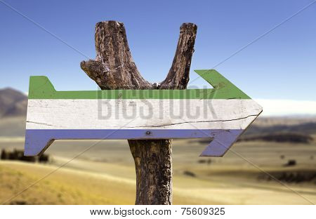 Sierra Leone wooden sign with a desert background