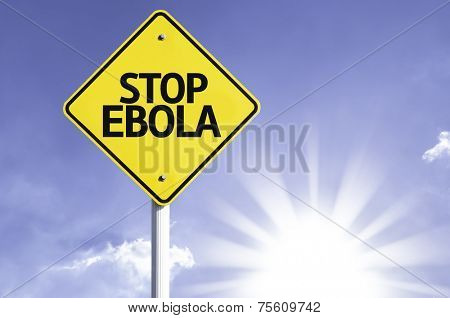 Stop Ebola road sign with sun background