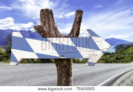 Bavaria wooden sign with a road background
