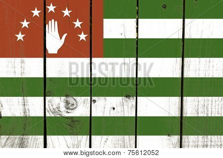 Abkhazia flag on wooden background