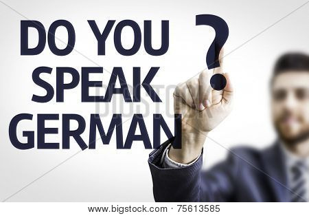 Business man pointing to transparent board with text: Do you Speak German?