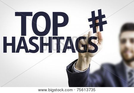 Business man pointing to transparent board with text: Top Hashtags 