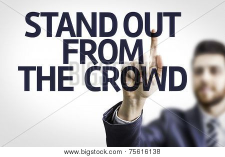 Business man pointing to transparent board with text: Stand Out From The Crowd 