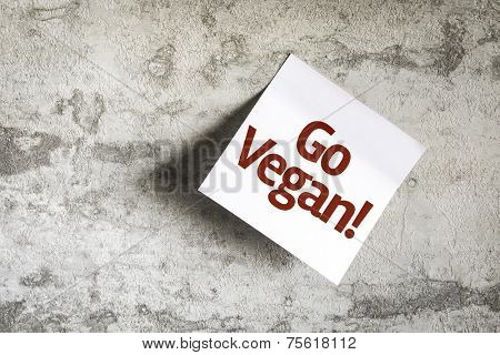 Go Vegan on Paper Note on texture background