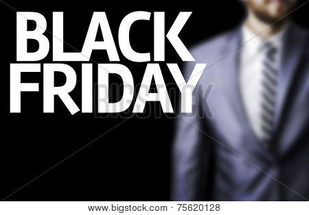 Business man with the text Happy Black Friday in a concept image