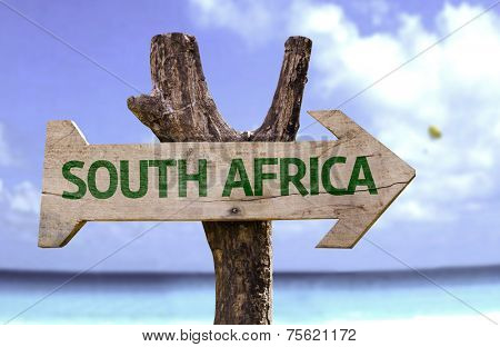South Africa wooden sign with a beach on background