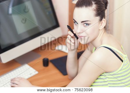 Smiling Happy Female Retoucher At Work Looking Backwards