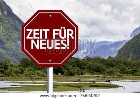 Time For New (In German) written on red road sign with landscape background