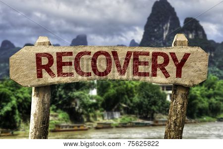 Recovery wooden sign with a forest background