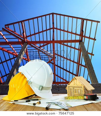 Architect Working Table Hard Hat House Model Plan Sheet And Writing Equipment Against Home Roof Stru