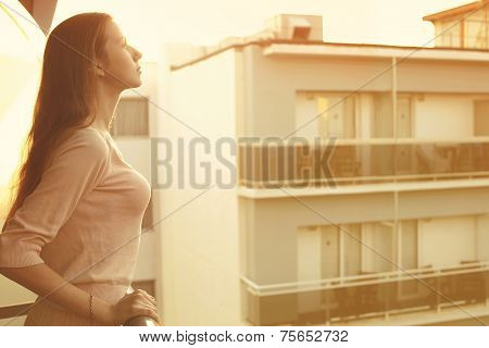 Pretty Woman Enjoing Sunny Light