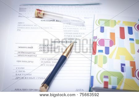 Filling In The Blood Test Blank With A Pen And Next  Vial