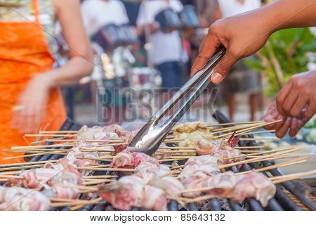 many prawns in bacon bbq sticks on grill, outdoor, summer bbq time