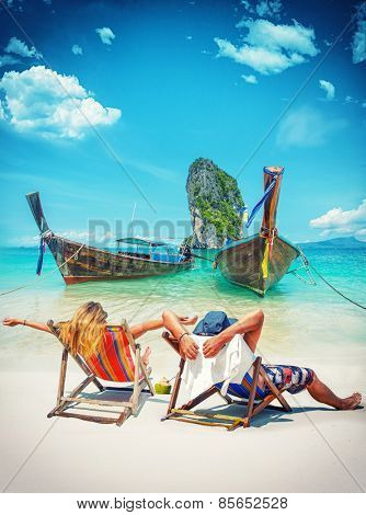 Couple of tourists on the beach in Thailand