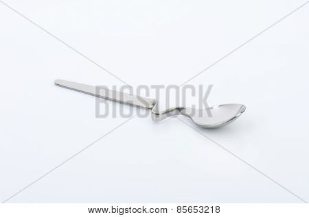 empty squiggly spoon on white background