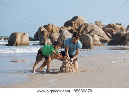 happy family on beach playing, father with son walking sea coast