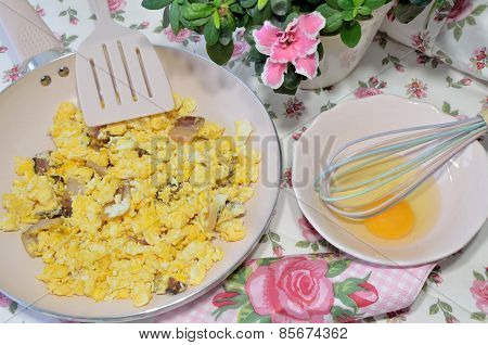 Preparing Bacon And Eggs