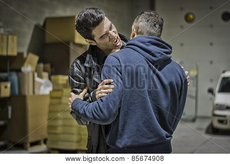 Hungry Young Male Vampire Bites Man Neck