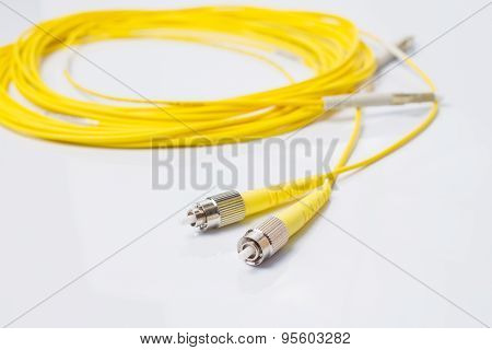 Close up of a fiber optic patchcord on white background