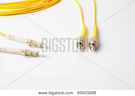 Close up of a fiber optic patchcord on white background