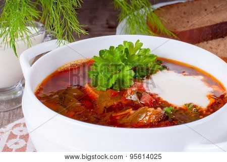 Borsch, Soup From A Beet, Meat And Cabbage With Tomato Sauce. Ukrainian And Russian National Cuisine