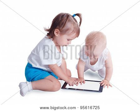 Two Little Kids Playing With Tablet Pc Computer, Isolated On White Background. Baby Hand Pointing On