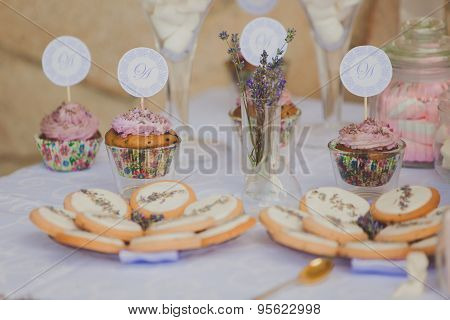 Dessert table for a wedding party. Biscuits decorated with lavanda flowers