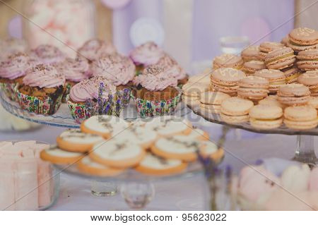 Dessert table for a wedding party. Biscuits decorated with lavanda flowers