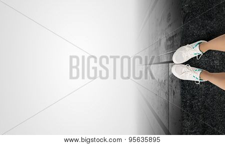 Woman standing on the edge of the roof