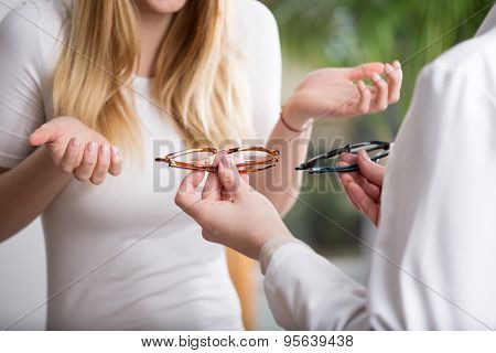 Undecided Woman In Eyeglasses Store