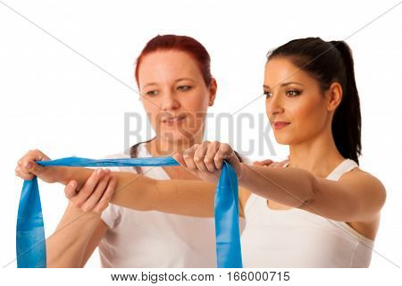 Physiotherapy - therapist doing arm strenghteninh excercises with a patient to recover strenght after injury