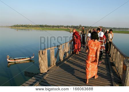 Amarapura Myanmar - 17 January 2010: People walking on the wooden bridge of U Bein on river Ayeyarwad Myanmar