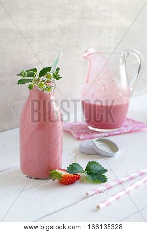 frest tasty strawberry smoothie with yoghurt in glass bottle