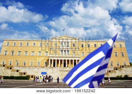 ATHENS - SEPTEMBER 9: People walk around the Greece parliament on Syntagma square on summer sunny day on 9th of September, 2016 in the Athens.